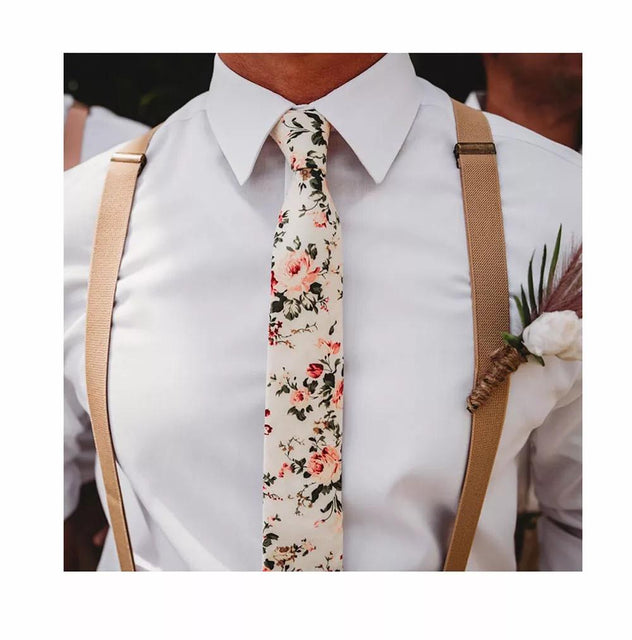 Crisp white shirt with cream floral tie and beige braces by the Brand Dickie Bow